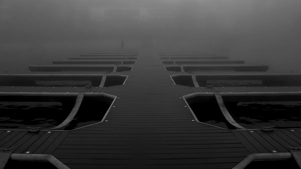 A lake dock vanishing into fog at Lake Arrowhead, California; illustrative stock photograph, not an image from Crystal Lake